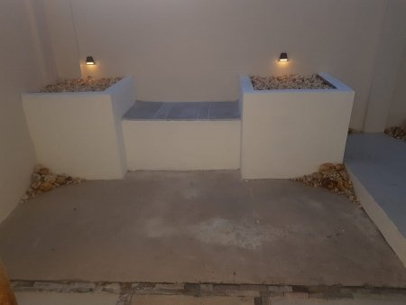Stone bench with dusk-to-dawn lights