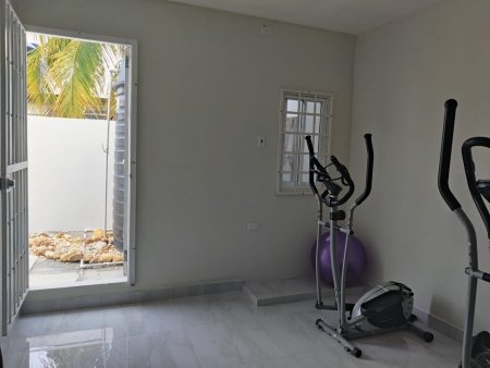 Access to rear yard relaxation area (cupboards were added below window after photo was taken)