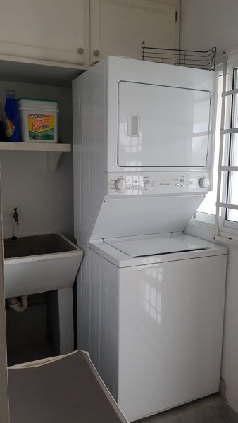 Washing area with shelving, sink and space for vertical washer/dryer